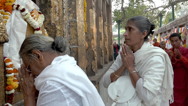 Sri Lankan pilgrims at Bodh Gaya shrine in India.