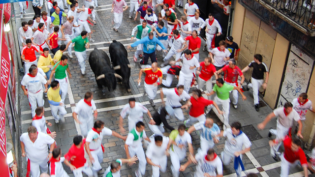 The Running of the Bulls in Pamplona, Spain.