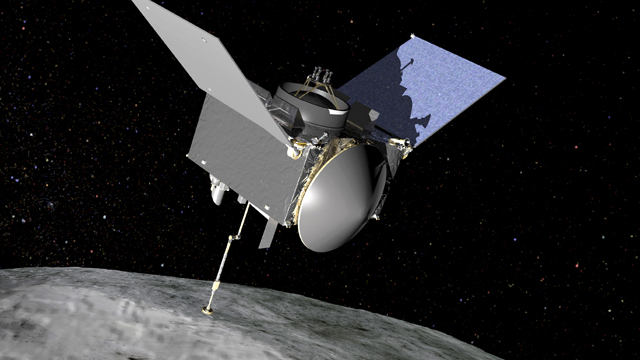 OSIRIS-REx extends its sampling arm as it moves in to make contact with the asteroid Bennu