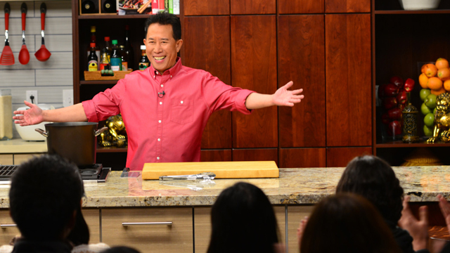 Host and chef Martin Yan welcoming the audience to his studio