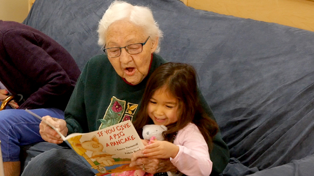 Children and residents read together